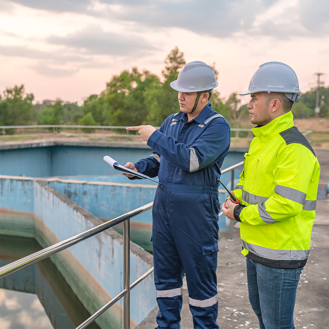 Engineers inspecting a sewage treatment plant to ensure smooth operations and automation compliance.