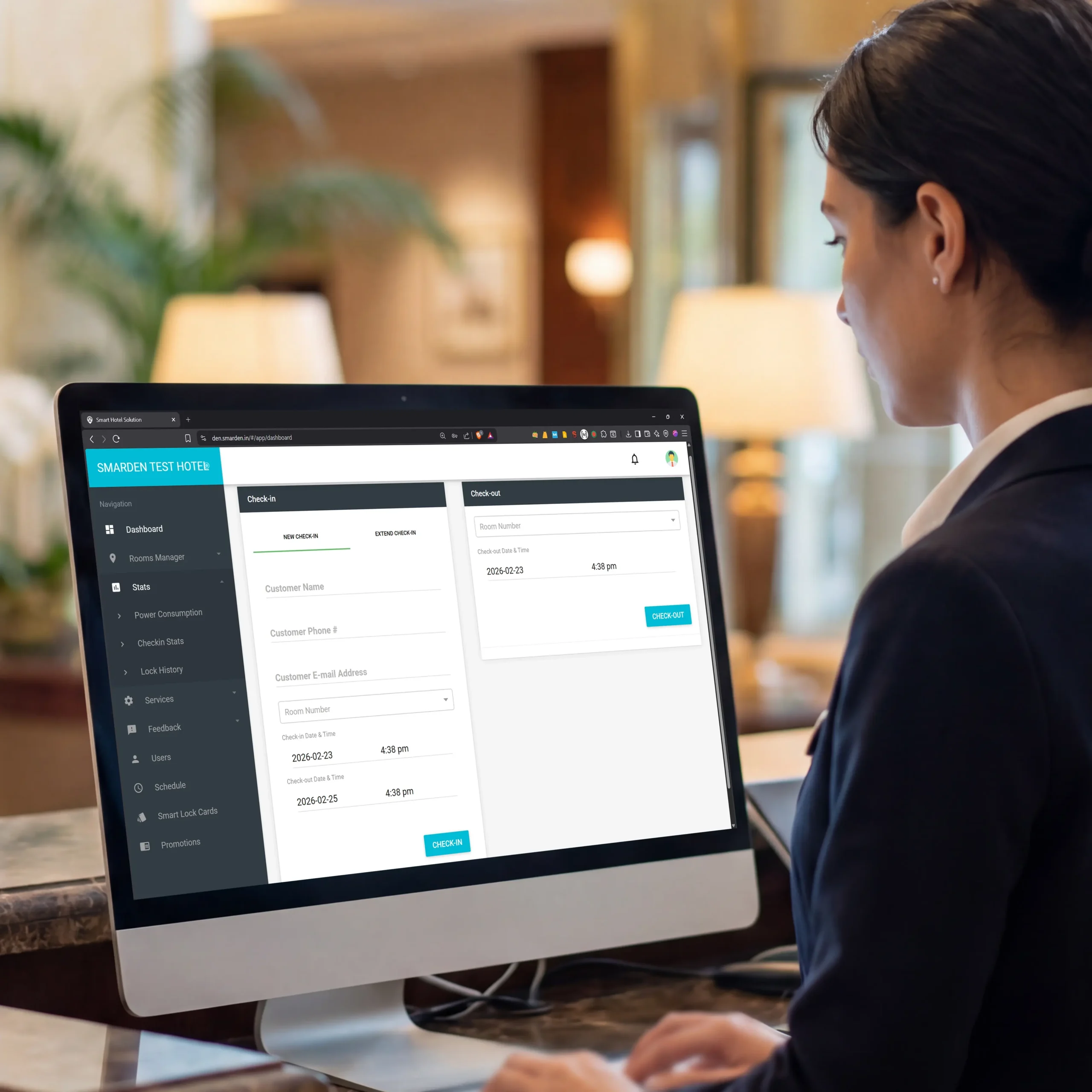 Hotel staff using SmarDen's Hotel Automation System dashboard for room and property management
